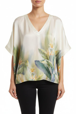 Woman wearing a floral blouse with a white background