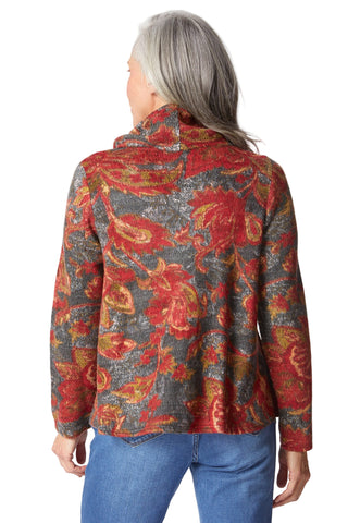 Person wearing a patterned jacket with red, orange, and gray colors on a white background