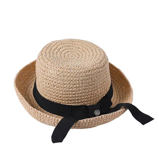 Beige straw hat with a black ribbon on a light gray background