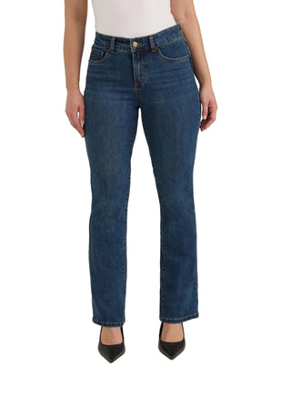 A model wearing a pair of dark blue straight-leg jeans, styled with a white top and black pointed-toe heels, photographed against a neutral light beige studio background.