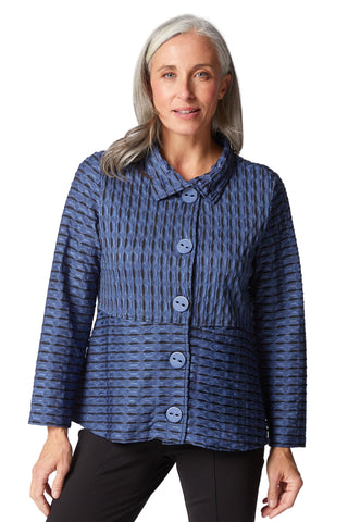 Woman wearing a blue patterned jacket on a white background