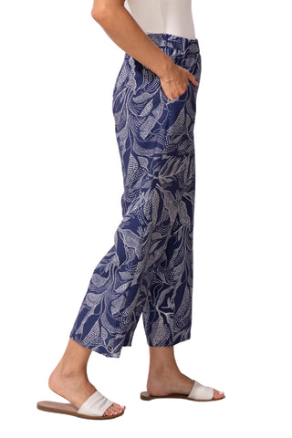 Person wearing blue patterned pants on a white background