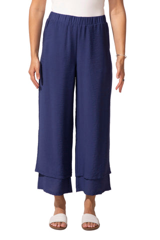 Navy blue wide-leg pants worn by a person on a white background