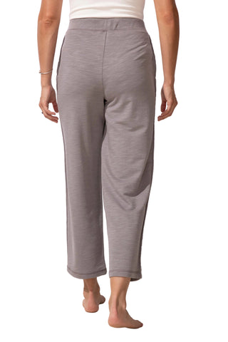 Person wearing gray pants on a white background