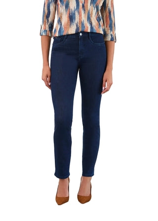 Person wearing dark blue jeans and a patterned top on a white background