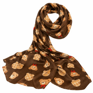 A brown infinity scarf with a repeating pattern of teddy bears and acorns, displayed on a white mannequin stand on a gray countertop.