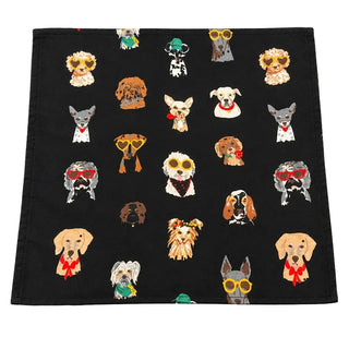 A square black scarf or fabric square featuring a repeating pattern of various dog illustrations wearing sunglasses and red neckties, laid flat on a gray textured surface.