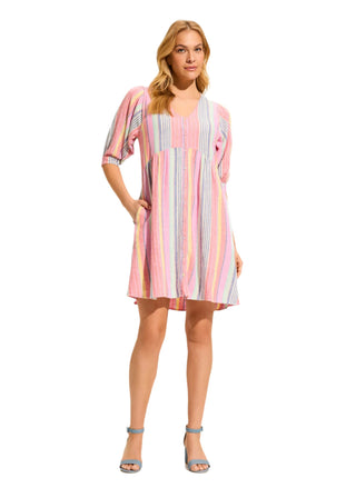Woman wearing a striped dress on a white background