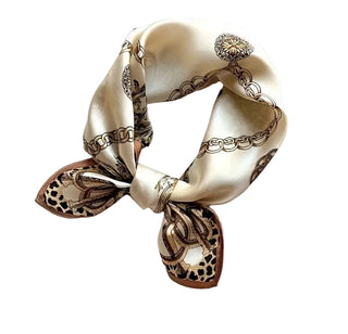 Beige scarf with chain and leopard print design on a white background