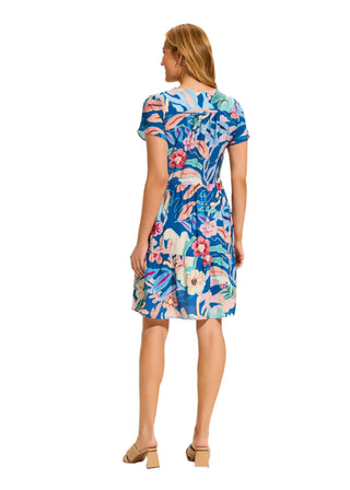 Woman wearing a floral dress on a white background