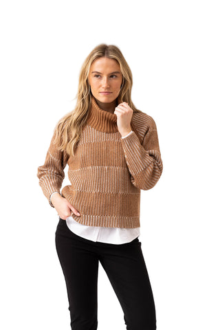 Woman wearing a brown ribbed sweater over a white shirt on a white background
