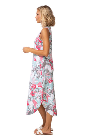 Woman wearing a floral dress against a white background