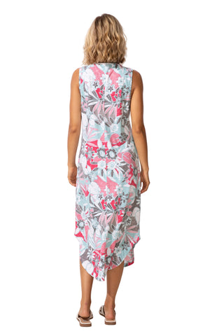 Woman wearing a floral dress against a white background