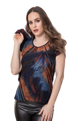 Woman wearing a colorful top with abstract design on a white background