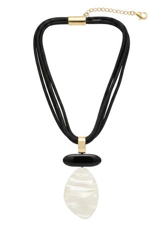 A multi-strand black cord necklace with a polished black oval pendant and a large teardrop-shaped white mother-of-pearl pendant, displayed on a black mannequin bust.