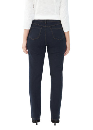 Person wearing dark blue jeans on a white background