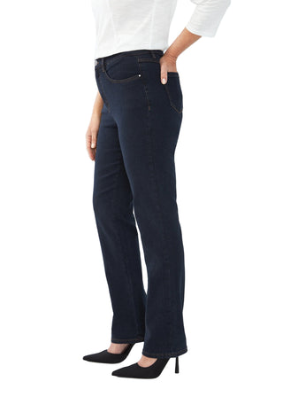 Person wearing dark blue jeans and a white shirt on a white background