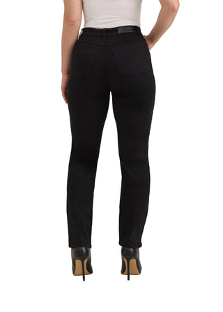 Rear view of a model wearing black high-waisted skinny jeans with a black leather belt, paired with a white top and black high heels with tan soles, against a light gray studio background.