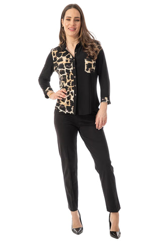 A woman modeling a black long-sleeve button-up shirt with a beige and black leopard print pattern on the yoke and chest pocket, paired with black pants and black pointed-toe heels, against a plain white studio background.
