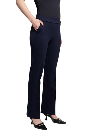 Navy blue pants worn by a person on a light gray background