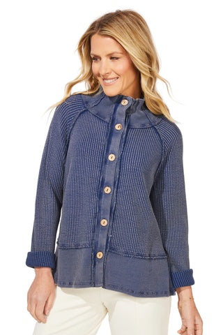 Woman wearing a blue checkered jacket with a white background