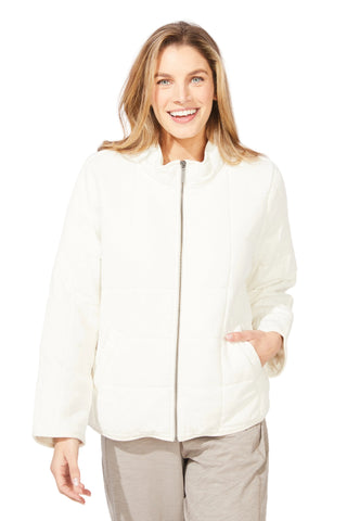 Woman wearing a white jacket on a plain background