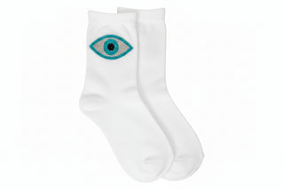 Gray socks with an eye design on a white background