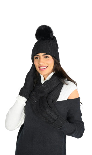 Woman wearing a black winter outfit with a hat, scarf, and gloves on a white background with 'Frank Lyman Montreal' branding.