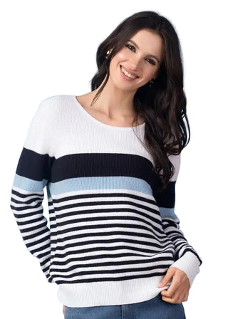 Woman wearing a striped sweater against a blue background
