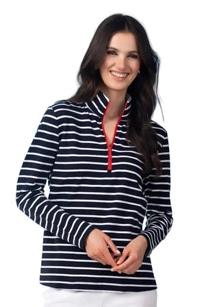 Woman wearing a black and white striped shirt with a red zipper against a blue background