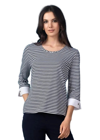 Woman wearing a black and white striped shirt against a blue background