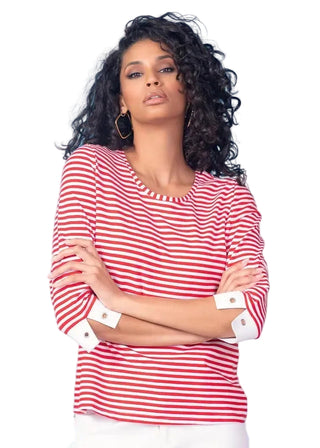 Woman wearing a red and white striped shirt against a light blue background