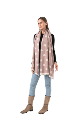 Woman wearing a heart-patterned scarf on a white background