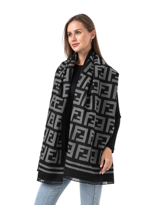 Woman wearing a black and gray patterned scarf on a white background