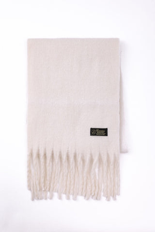 White scarf with fringe on a white background