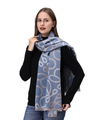 Woman wearing a blue patterned scarf on a white background