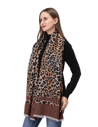 Woman wearing a leopard print scarf on a white background