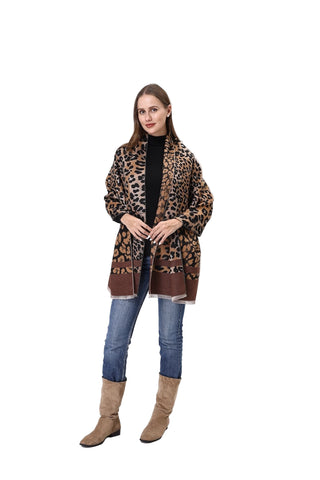 Woman wearing a leopard print coat on a white background