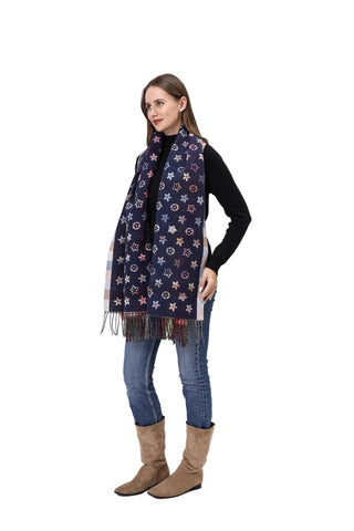 Woman wearing a patterned scarf, black sweater, jeans, and brown boots on a white background