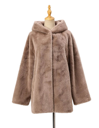 Brown faux fur coat on a mannequin against a white background