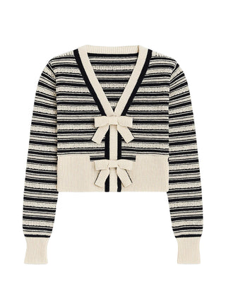 Striped sweater with bow details on a white background