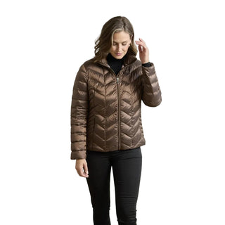Woman wearing a brown puffer jacket against a neutral background