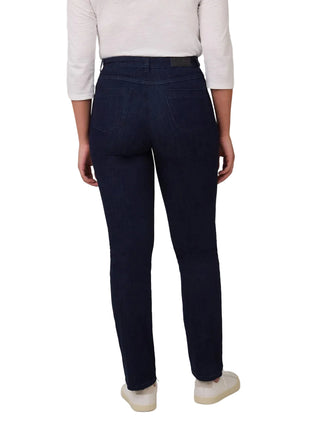 Person wearing navy pants on a white background