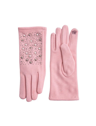 Pair of pink gloves with one decorated with rhinestones on a light gray background