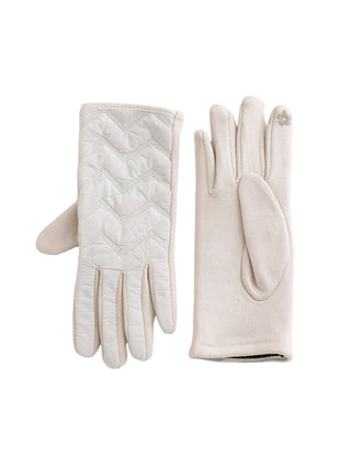 Pair of cream-colored gloves on a white background