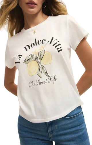 White t-shirt with 'La Dolce Vita, The Sweet Life' print featuring lemons and leaves worn by a person.