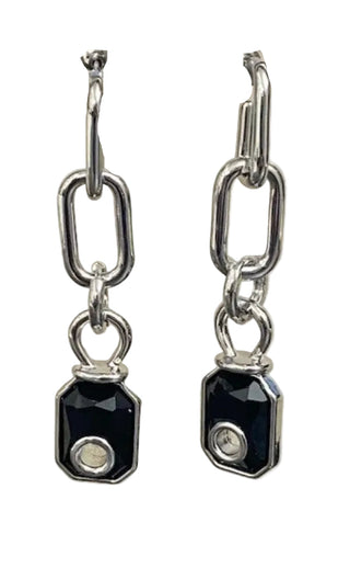 Pair of silver chain earrings with black gemstones on a beige card.
