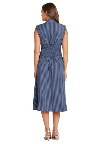 Woman wearing a blue striped dress on a white background