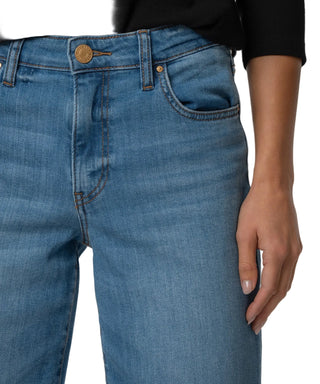 Close-up of blue jeans with a neutral background