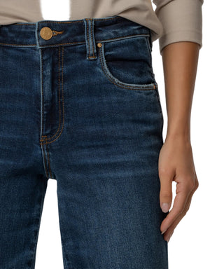 Close-up of blue jeans with a neutral background